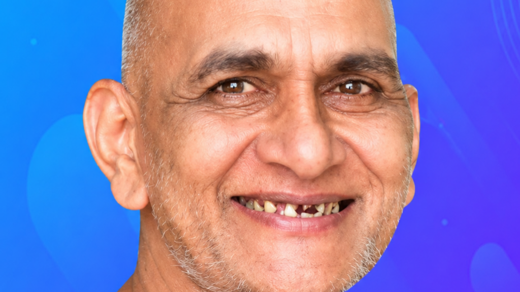 Close-up of a smiling man with missing teeth against a blue abstract background.
