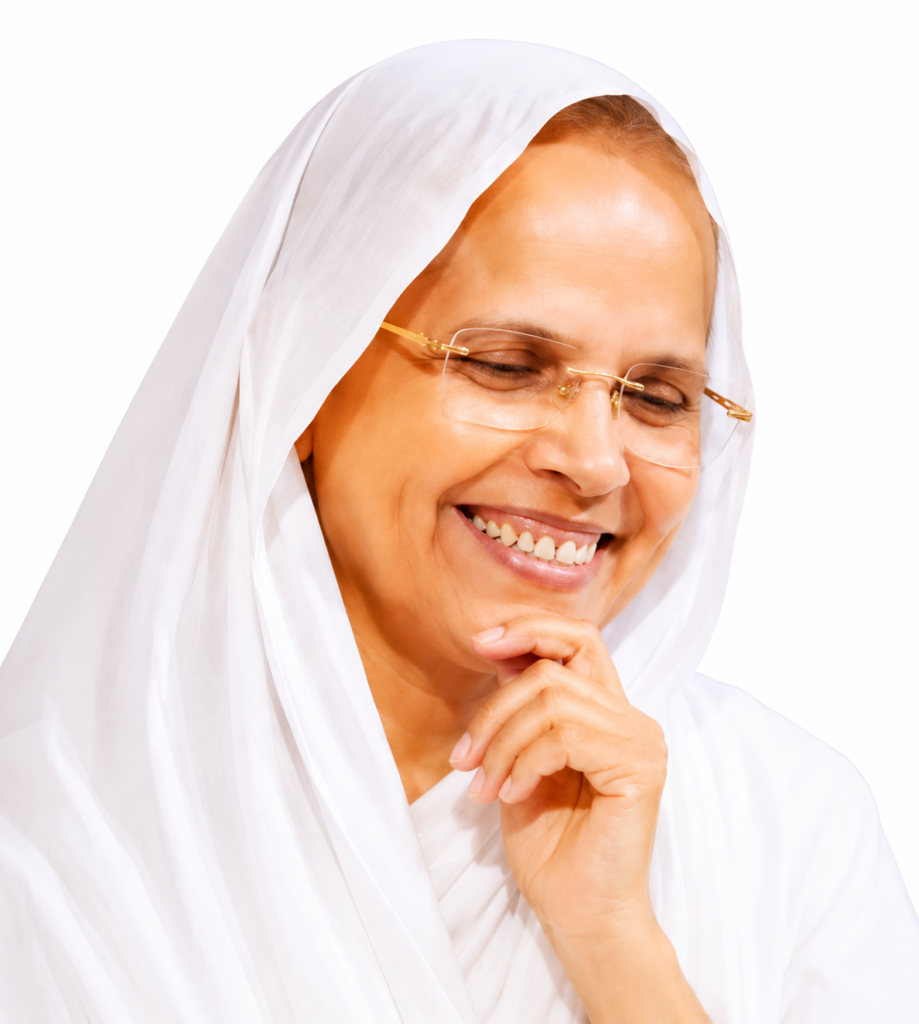 Smiling woman in a white hijab and glasses, resting her chin on her hand in a portrait.