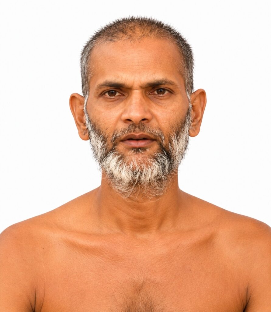 Front-facing portrait of a middle-aged man with a short gray beard and bare shoulders against a white background.