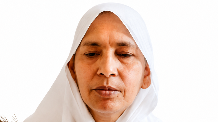 Portrait of a middle-aged woman wearing a white hijab, looking downward with a calm expression.