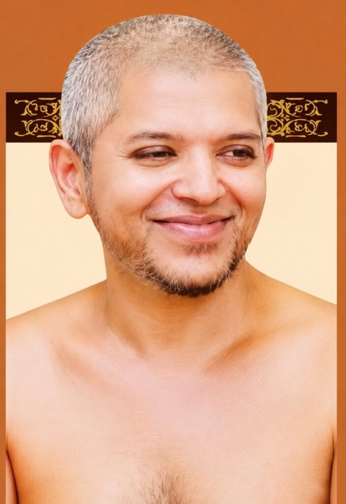 Smiling man with short gray hair and light stubble, shirtless against a warm brown-beige backdrop.