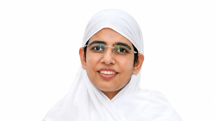 Portrait of a smiling woman in a white hijab and glasses against a white background.