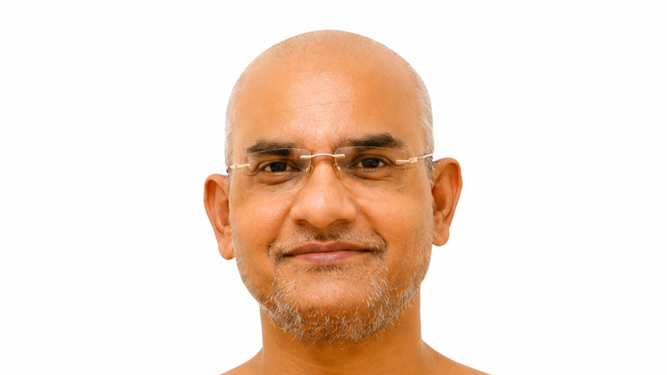 Portrait of a middle-aged bald man with glasses and light gray facial hair on a white background.