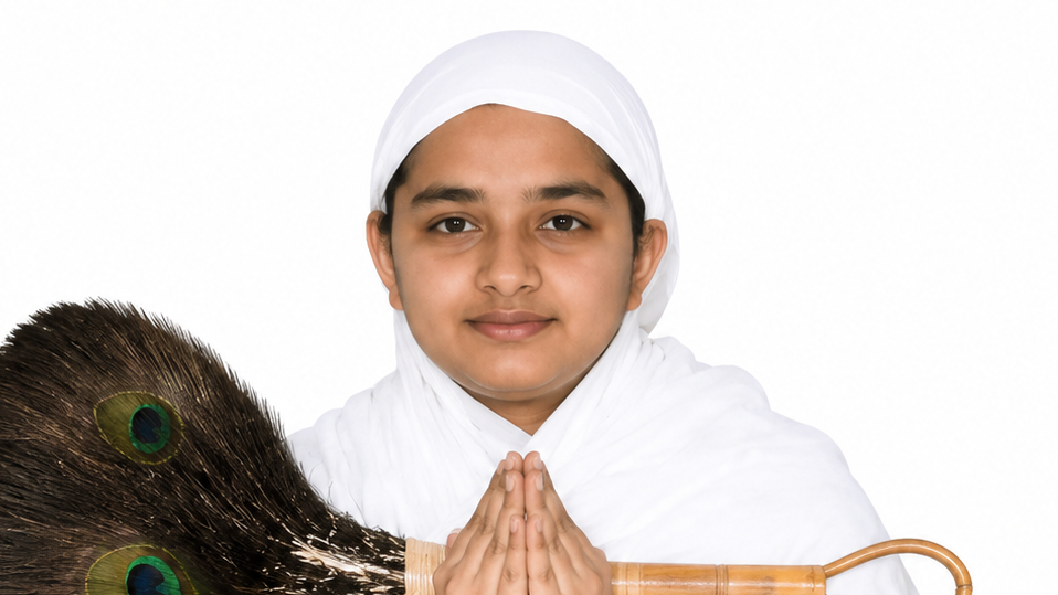 Girl in white headscarf with hands in prayer holding a peacock feather duster