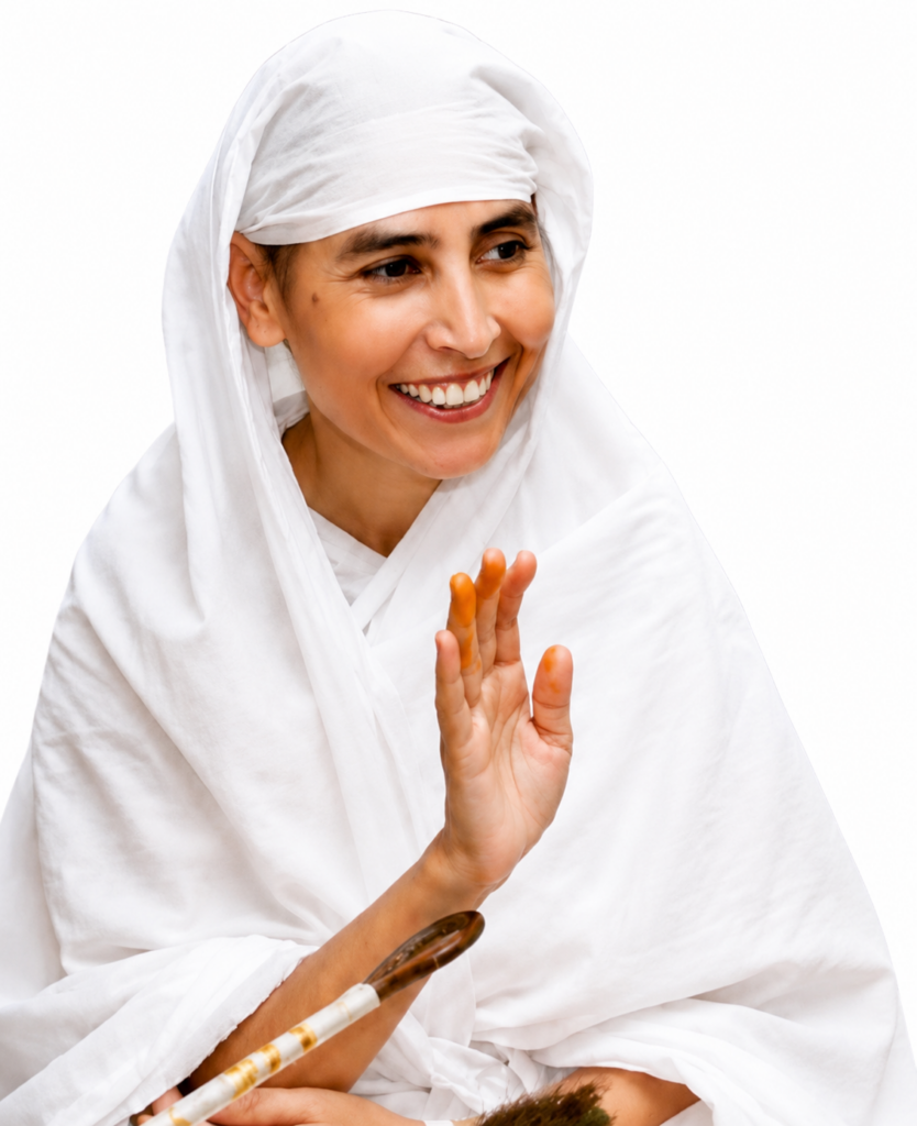 Smiling woman in a white headscarf and robe raises her hand in a friendly wave with a brush resting nearby (informative image)