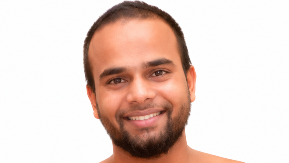 Close-up portrait of a smiling man with short dark hair and a trimmed beard against a white background.