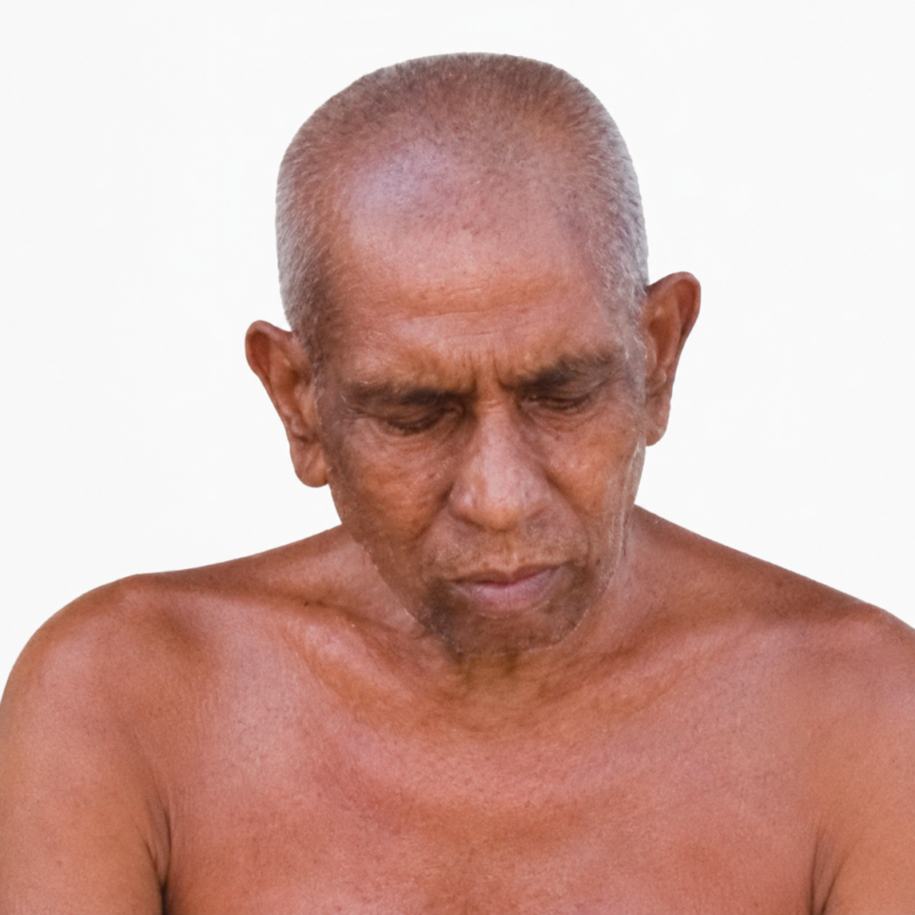 Older man with short gray hair, looking downward, bare shoulders against a white background, neutral expression