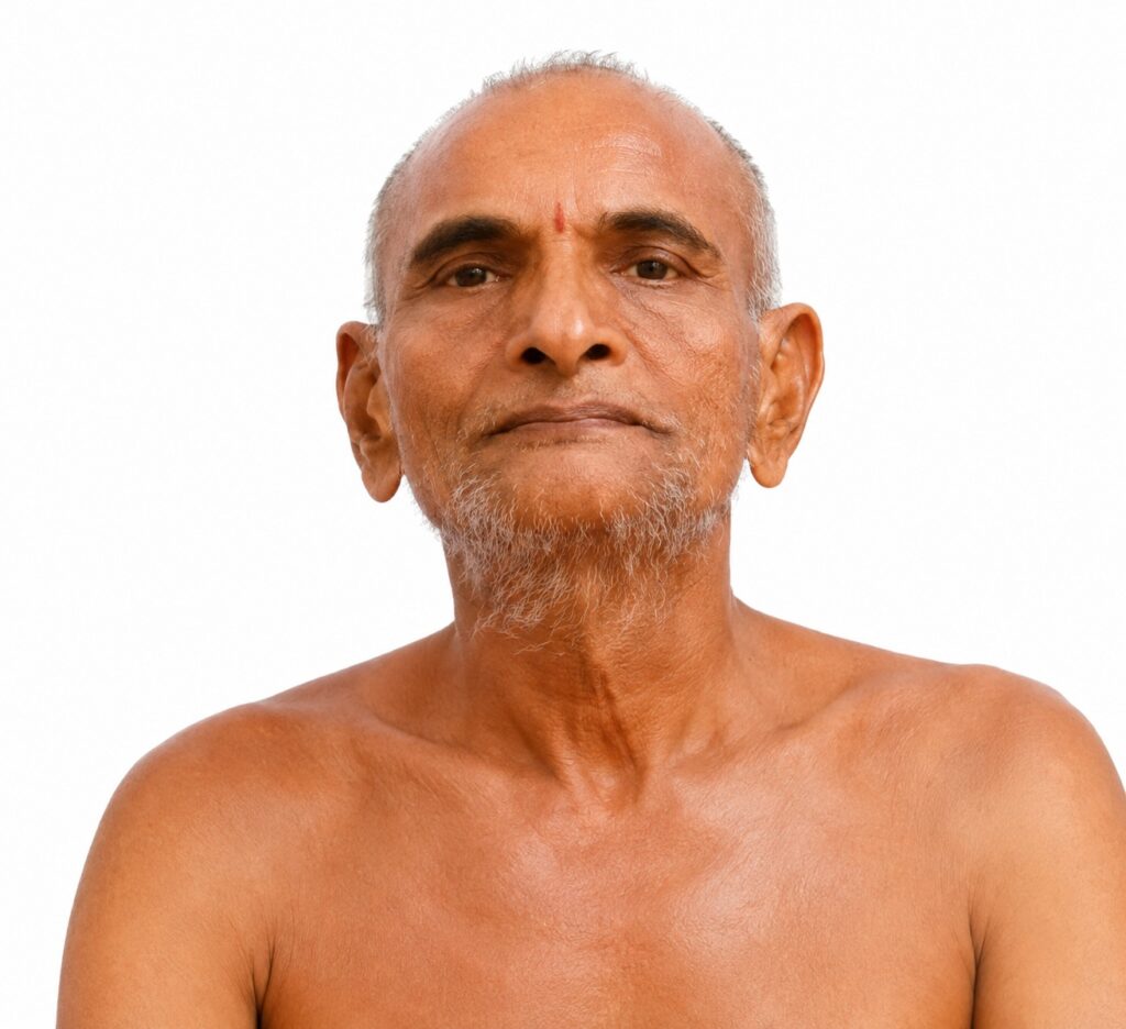 Portrait of an older man with a gray beard and mustache, bare shoulders, looking at the camera against a white background.