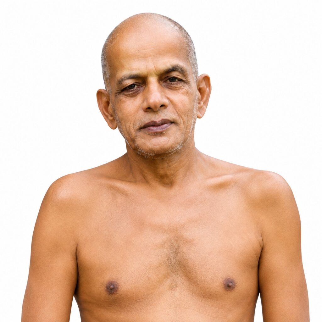 Portrait of an older man with a shaved head and gray stubble, bare torso, looking calmly at the camera against a white background.