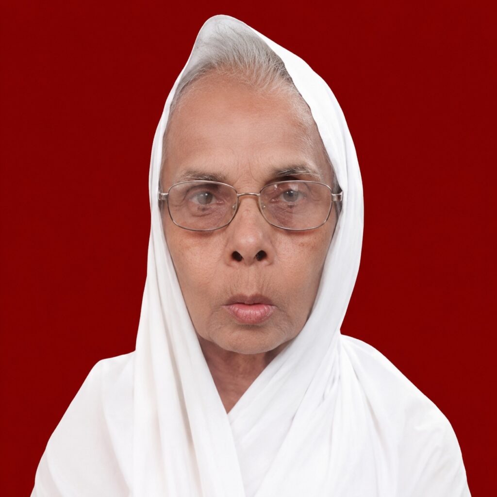 Close-up portrait of an elderly woman in a white headscarf and glasses, with a solid red background.