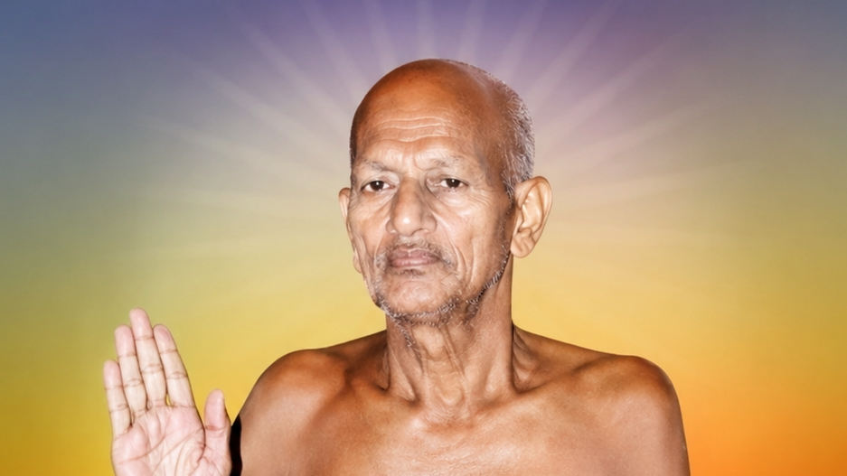 Older, shirtless man with a calm expression raises his right hand in blessing against a multicolored halo background.