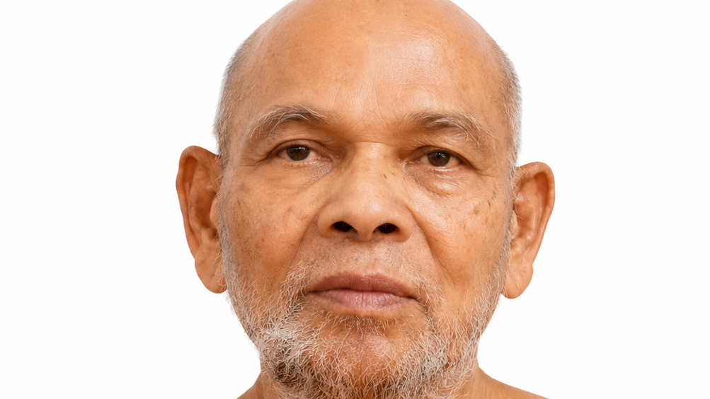 Close-up of an older man with a light grey beard, looking straight ahead against a white background. (informative)