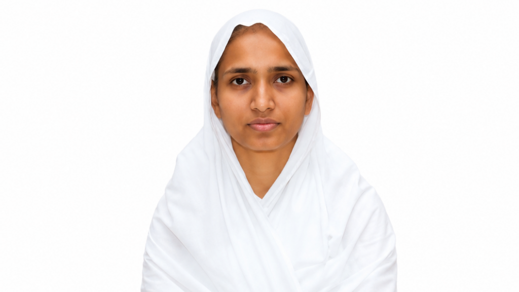 Portrait of a woman wearing a white hijab and white clothing against a plain white background.