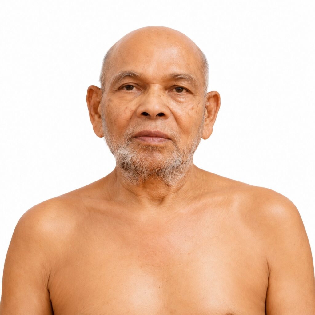 Portrait of an older man with a gray beard facing the camera against a white background.