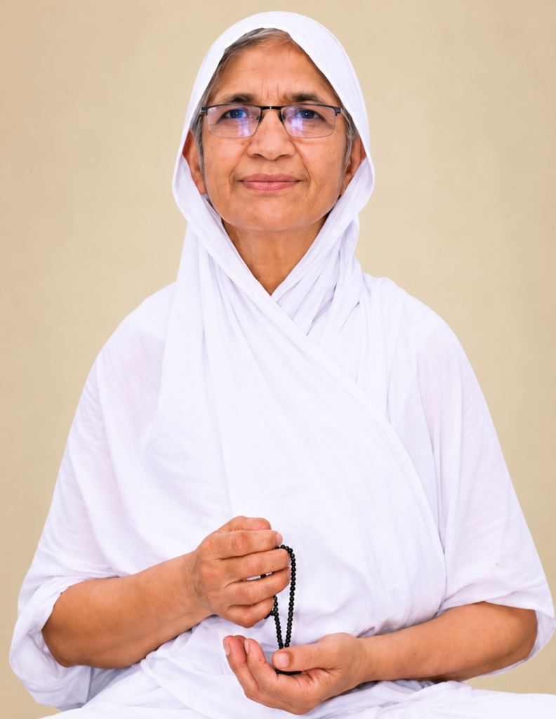 Older woman in a white headscarf and robe, meditating with prayer beads in her hands.