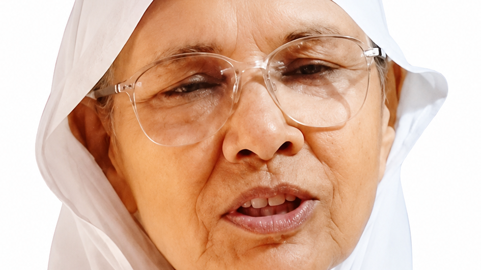 Close-up of an elderly woman wearing a white headscarf and clear-framed glasses, looking slightly to the left.