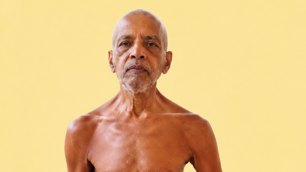 Portrait of an older man, shirtless, facing the camera with a neutral expression against a yellow background.