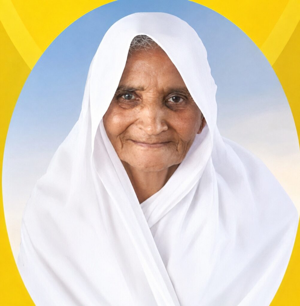 Close-up of an elderly woman in a white headscarf, smiling at the camera, yellow backdrop with a blue circle.
