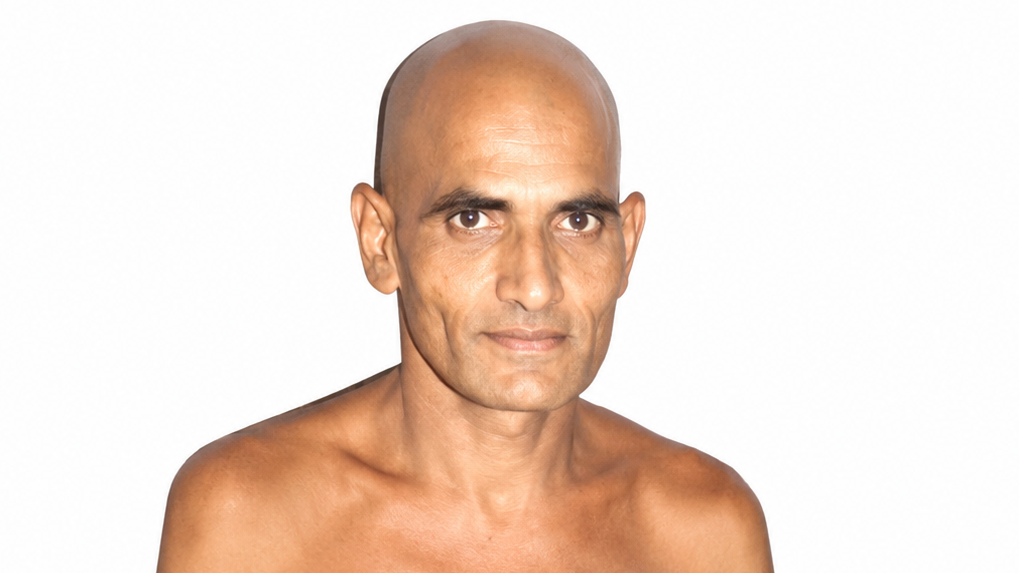 Head-and-shoulders portrait of a bald man with a neutral expression against a white background.