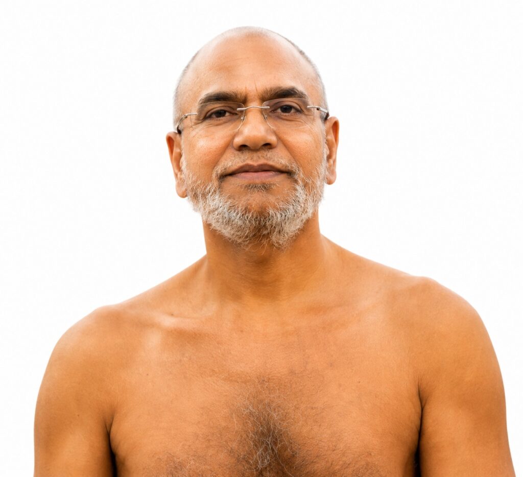 Portrait of a middle-aged man with glasses and a gray beard, bare shoulders, neutral expression against a white background